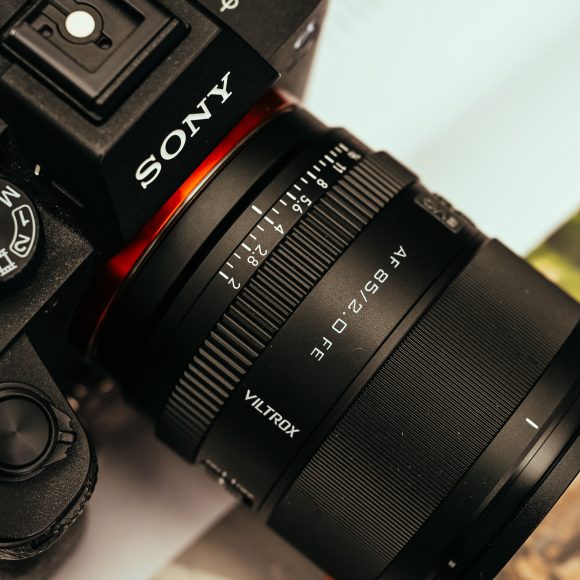 Close-up of a Sony camera with a Viltrox 45mm f/1.8 lens attached, viewed from above.
