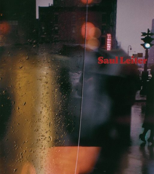 Rainy city street through a wet window with blurred lights and shadows; Saul Leiter in red text.