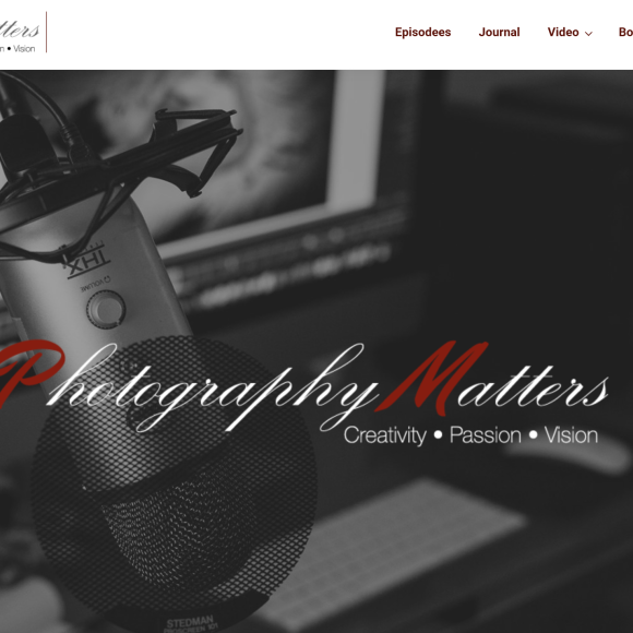 A close-up of a microphone in a recording setup, with Photography Matters logo and website menu at the top.